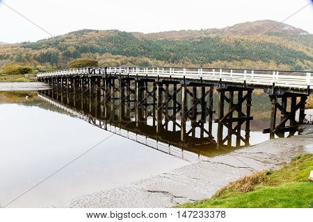 Wooden structure Penmaenpool toll bridge over the River Mawddach near Dolgellau Wales United Kingdom