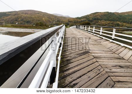 Wooden structure Penmaenpool toll bridge over the River Mawddach near Dolgellau Wales United Kingdom
