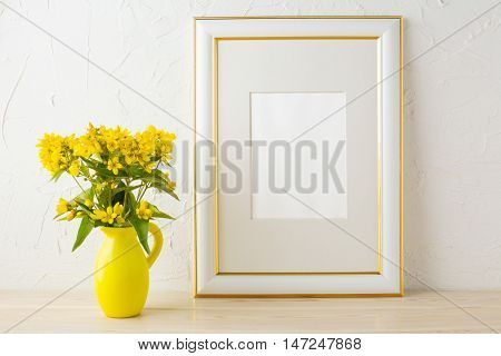 Frame mockup with small yellow flowers in stylized pitcher vase. Poster white frame mockup. Empty white frame mockup for presentation design.