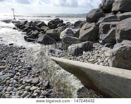 Rocky beach and river seascape photographed at Amroth in Pembrokeshire