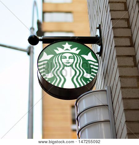 NEW YORK NY - SEPTEMBER 9th 2016: Starbucks sign hanging outside of location in Upper East Side Manhattan during daytime