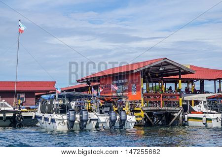 Semporna,Sabah-Sept 10,2016:Jetty of speedboats terminal in Semporna, Sabah, Borneo on 10th Sept 2016.Its a gateway for diving & snorkeling trips to the islands of Sipadan,Mabul, Mataking, Maiga & others