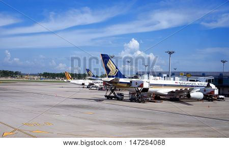 singapore, singapore - september 2, 2016: aircraft docked at Changi Airport. Singapore Changi Airport, is the primary civilian airport for Singapore, and one of the largest transportation hubs in Southeast Asia