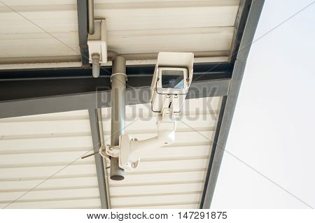 CCTV security camera on the roof of the station platform