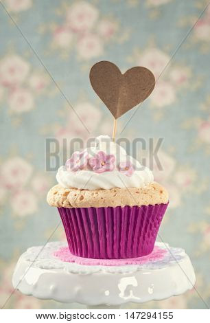 Cupcake with a heart cakepick