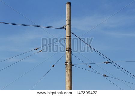 Horizontal photo of concrete pillar anchored with steel cables
