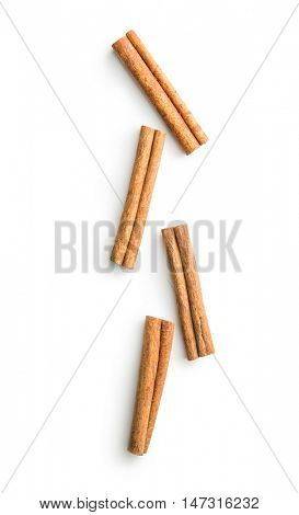 Cinnamon sticks spice isolated on white background. Top view.