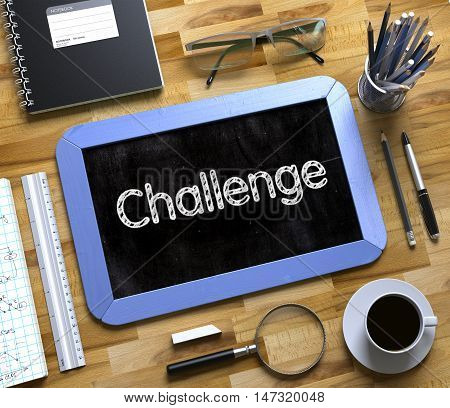 Small Chalkboard with Challenge Concept. Top View of Office Desk with Stationery and Blue Small Chalkboard with Business Concept - Challenge. 3d Rendering.