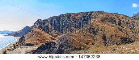 Wild beach in Crimea near the mountain range