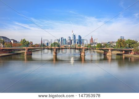 Daytime view of Frankfurt city skyline with Alte Brucke bridge