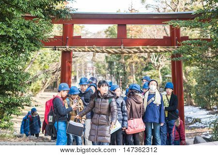Kamakura, Japan - February 21 2014 - Japanese scholars in the entrance of the Tsurugaoka Hachiman-gū shrine Kamakura Japan