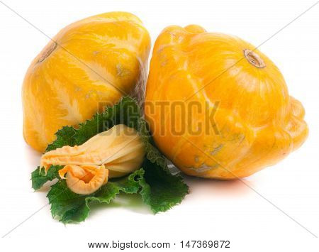 two yellow pattypan squash with leaf and flower isolated on white background.