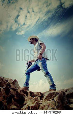 Man On Top Of Mountain Is Taking Pictures