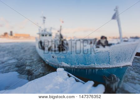 The Icebreaker Ship Trapped In Ice Tries To Break And Leave The Bay Between The Glaciers