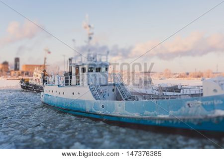 The Icebreaker Ship Trapped In Ice Tries To Break And Leave The Bay Between The Glaciers