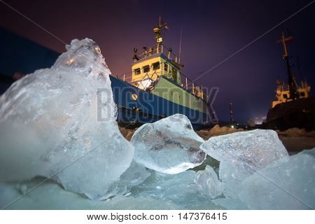 The Icebreaker Ship Trapped In Ice Tries To Break And Leave The Bay Between The Glaciers