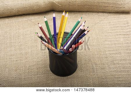 Set of Colorful pencils with holder - artistic concept.