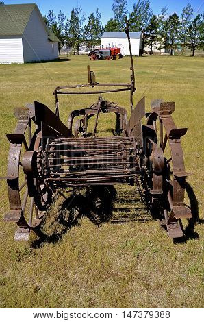 An old horse drawn potato picker used to dig the spuds out of the ground.