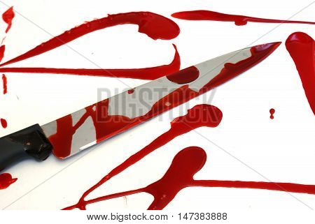 A bloody knife scene over a white base.