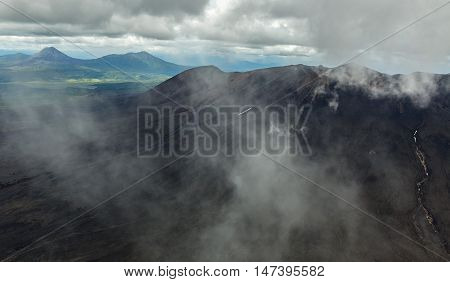 Maly Semyachik is a stratovolcano. Kronotsky Nature Reserve on Kamchatka Peninsula. View from helicopter.