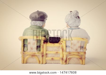 Lovely Grandparent Doll Siting Rocking Bamboo Chair Isolate On White Background