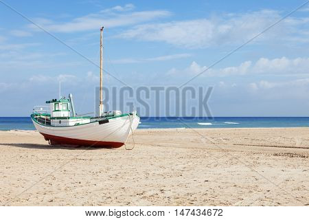 Fishing boats stranded on the beach at low tide