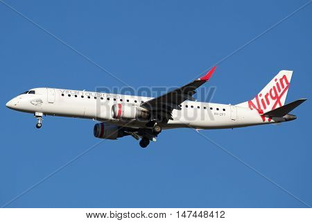 BRISBANE, AUSTRALIA - June 30: A Virgin Australia Embraer E190 jet is seen arriving in to Brisbane, Australia, on Thursday, 30th June, 2016