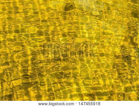 water texture pattern backgroundgold water in sea on morning time