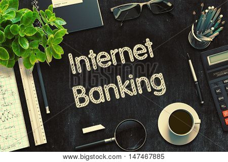 Internet Banking Handwritten on Black Chalkboard. Top View Composition with Black Chalkboard with Office Supplies Around. 3d Rendering. Toned Illustration.