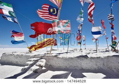 UYUNI BOLIVIA - August 28 2016. Flags of various nations in Salar de Uyuni Bolivia on August 28 2016. Salar de Uyuni is the worlds largest salt flat at 10582 square kilometres.