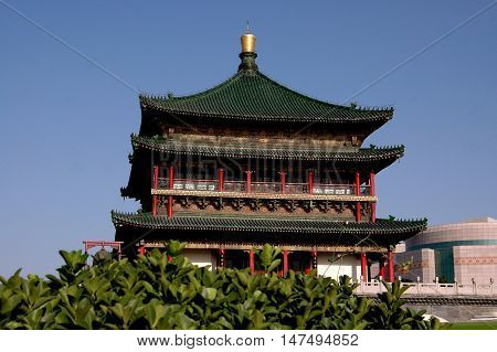 Xi'an China - September 8 2006: C.1384 Bell Tower rises 30 meters high at the center of Ginwa Plaza
