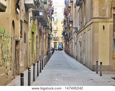 BARCELONA, SPAIN - APRIL 2014. Old streets of Gothic Quarter of Barcelona, Catalonia. It is centre of old city of Barcelona. Center of touristic life