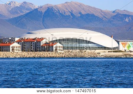Sochi, Russia - NOVEMBER 8, 2014:  Luxury residential houses in Adler on a background of the Bolshoi Ice Palace in the Imereti lowland