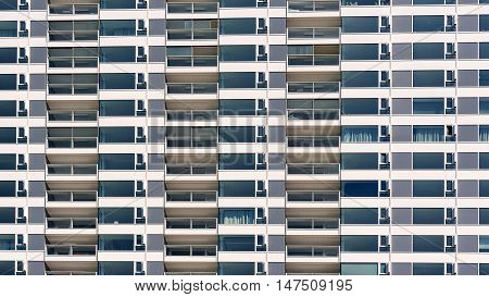 Repeating pattern of windows on new modern apartment building.