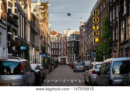 Amsterdam Netherlands - July 02 2016: The traditional Dutch houses on Kerkstraat street evening time
