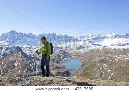 Hiker With A Pyrenean Lake As Background