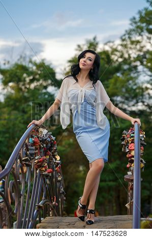 Stylish young girl on the bridge. Rostova portrait. Street fashion.