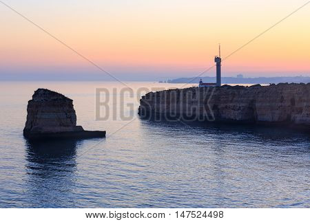 Sea Coast Sunset View With Lighthouse.