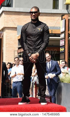 LOS ANGELES - SEP 07:  Usher arrives to the Walk of Fame honors Usher on September 07, 2016 in Hollywood, CA                