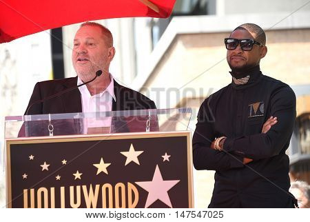 LOS ANGELES - SEP 07:  Usher and Harvey Weinstein arrives to the Walk of Fame honors Usher on September 07, 2016 in Hollywood, CA                