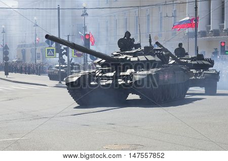 SAINT PETERSBURG, RUSSIA - MAY 09, 2015: A column of tanks T-90 goes from the Palace square. The end of the parade in honor of Victory Day, St. Petersburg