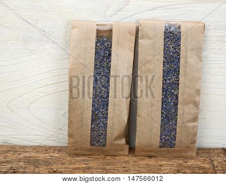 two carton bags of levender on a wooden table background