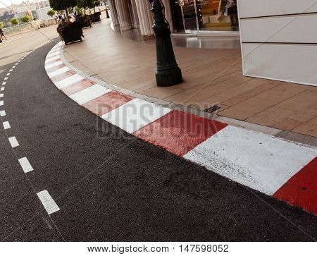 Car race asphalt and curb on Monaco Montecarlo Grand Prix street circuit.