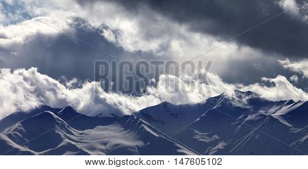 Panoramic View On Evening Mountains In Clouds