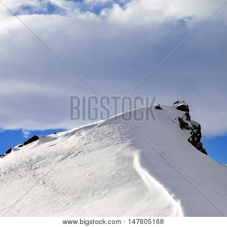 Top Of Mountains With Snow Cornice After Snowfall