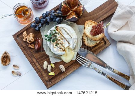 Baked Camambert Cheese With Jam Decorated  Almond
