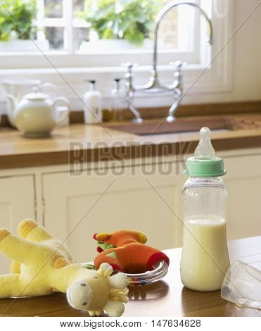 Closeup of baby Items on kitchen counter by cellphone and keys