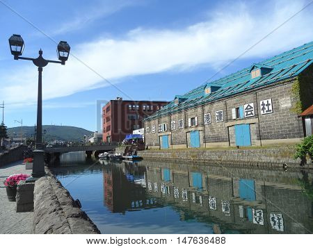 Reflection of The Old Warehouse along Otaru Canal, Landmark of Otaru Town in Japan