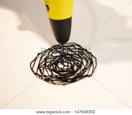 Man 3d pen drawing circles close-up on white paper