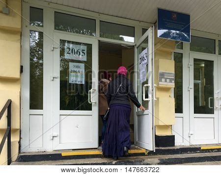 Moscow, Russia - September 18, 2016: Voters Enter A Polling Station To Take Part In Voting On Electi
